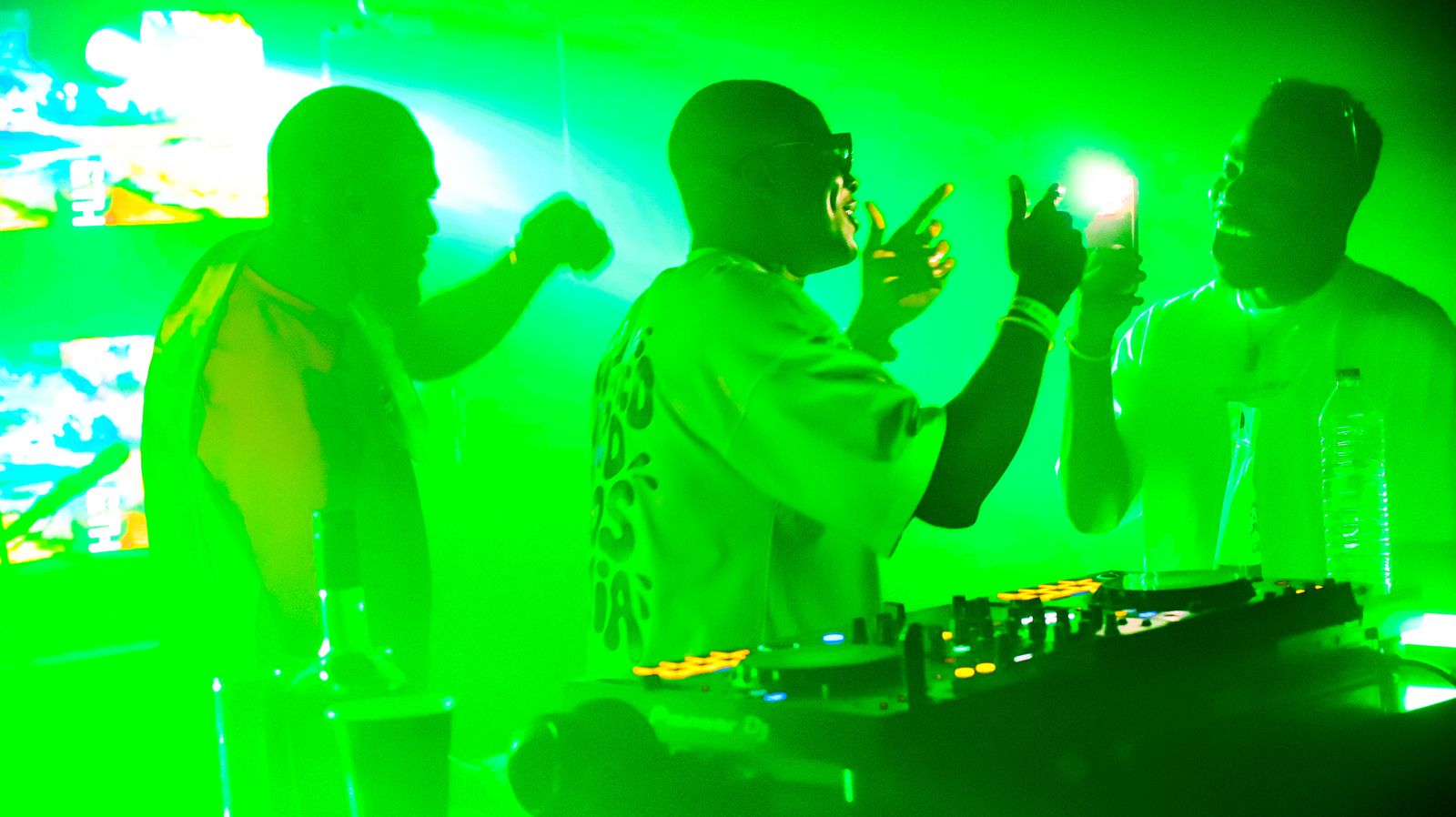Packed dancefloor in green