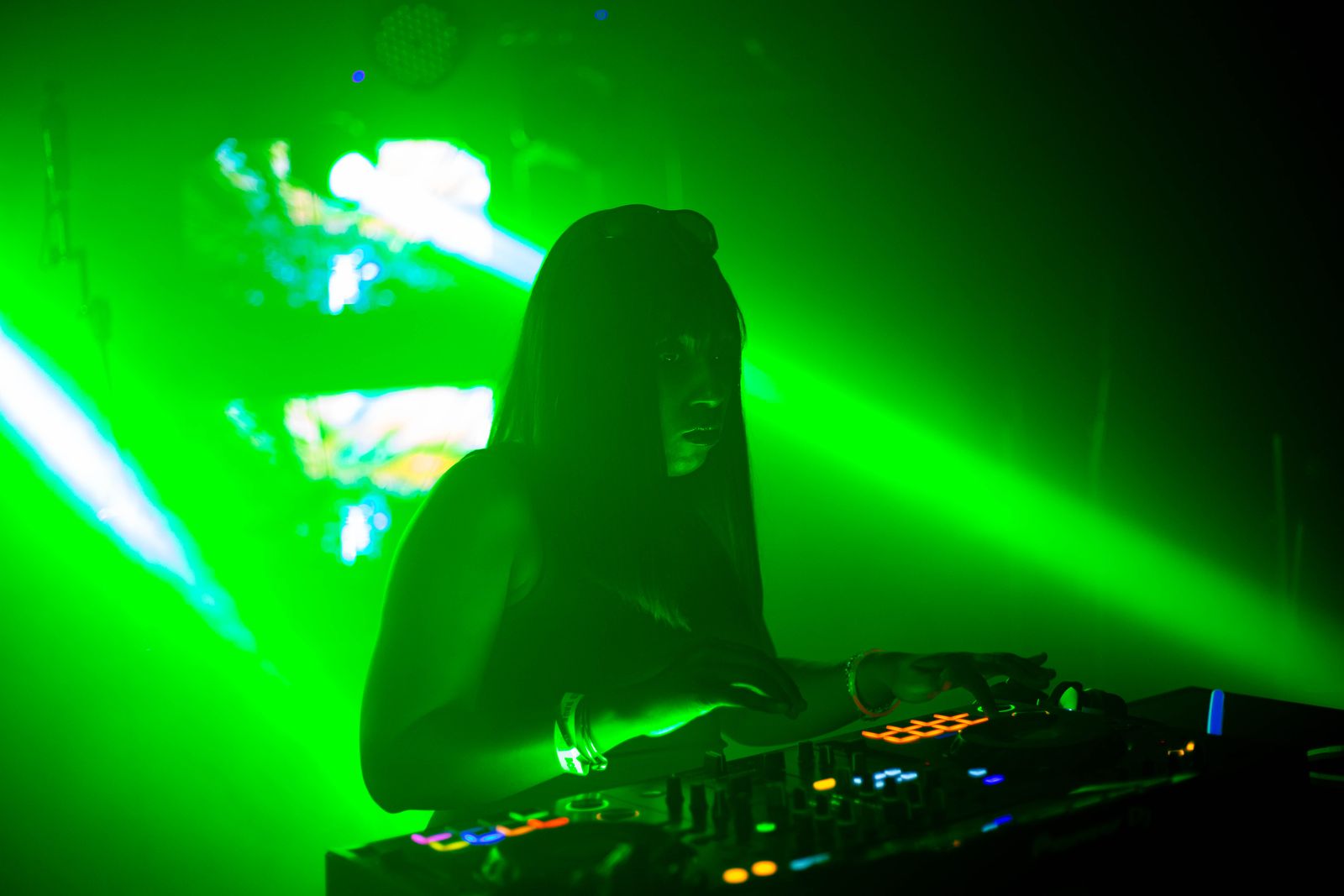 DJ under green lasers